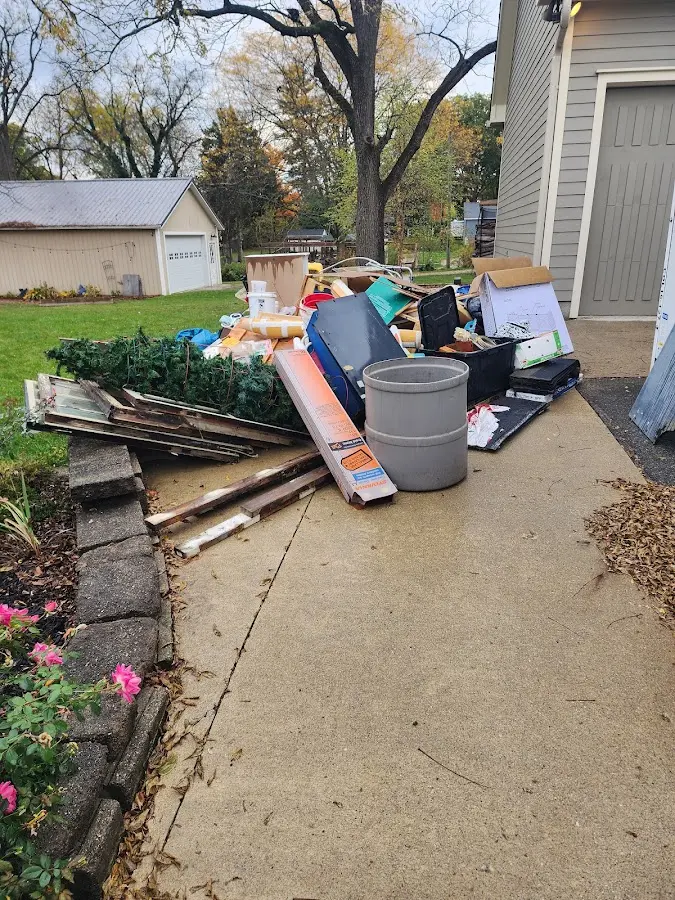Dumpster being loaded with debris for 30 Yard Dumpster Rental in Oakdale